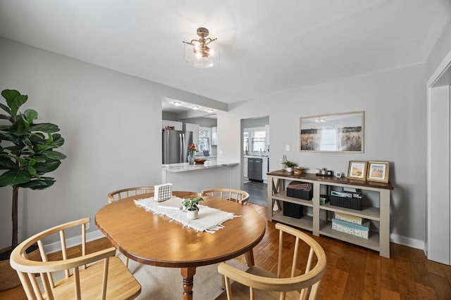 dining area featuring dark hardwood / wood-style floors