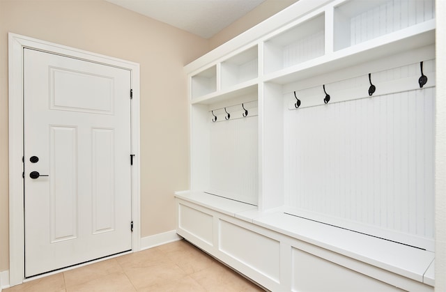 mudroom with light tile patterned floors