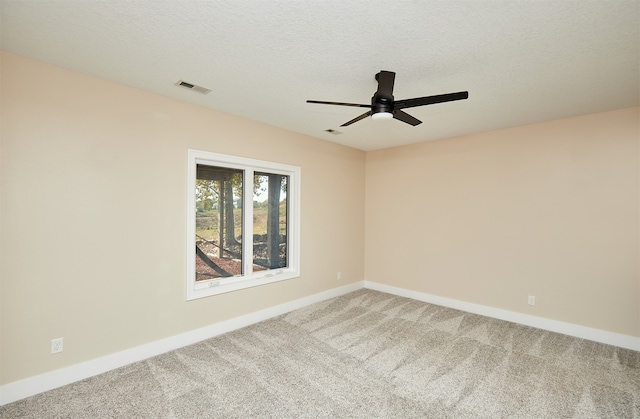 unfurnished room with carpet flooring, a textured ceiling, and ceiling fan