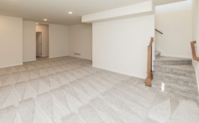 basement with light colored carpet