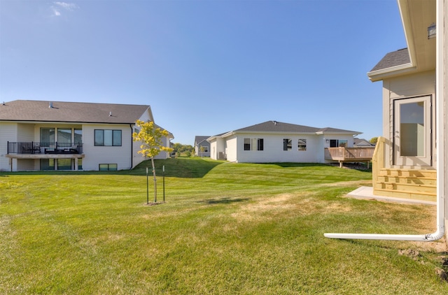 view of yard with a wooden deck