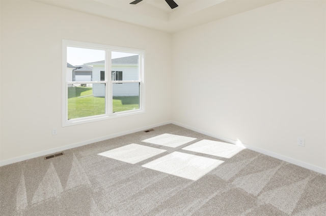 empty room featuring carpet and ceiling fan