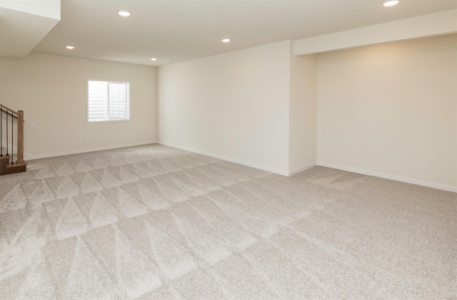 7011 Lincoln Cir, Johnston, IA 50131 - basement with recessed lighting, light carpet, stairway, and baseboards