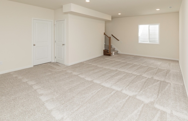 interior space featuring light carpet