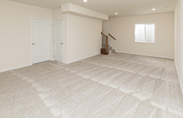 7011 Lincoln Cir, Johnston, IA 50131 - below grade area with carpet, stairway, recessed lighting, and baseboards