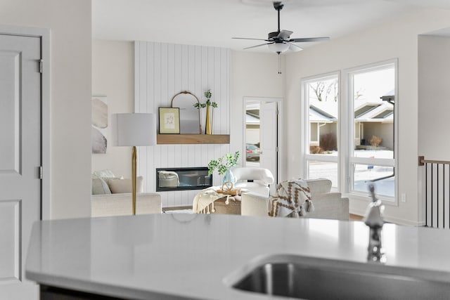 kitchen with ceiling fan and a healthy amount of sunlight