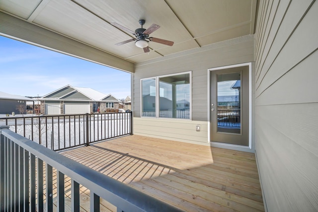 wooden terrace featuring ceiling fan