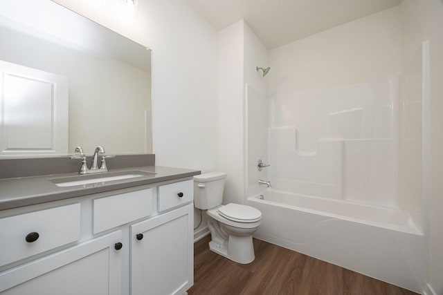 8916 Beery Pl, Johnston, IA 50131 - full bathroom with toilet, wood finished floors, vanity, and washtub / shower combination