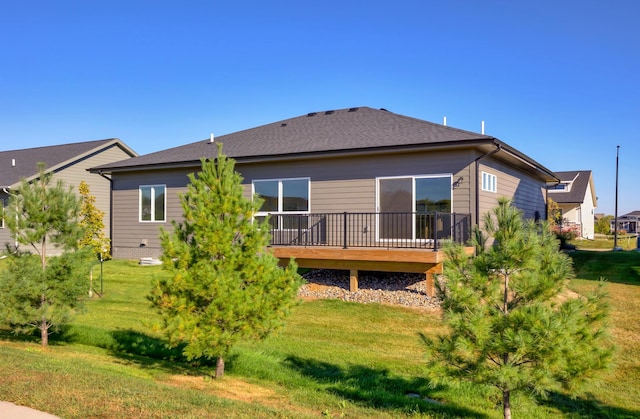 8916 Beery Pl, Johnston, IA 50131 - rear view of property with a deck and a lawn
