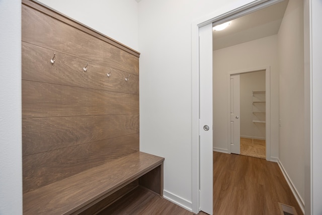 mudroom with wood-type flooring