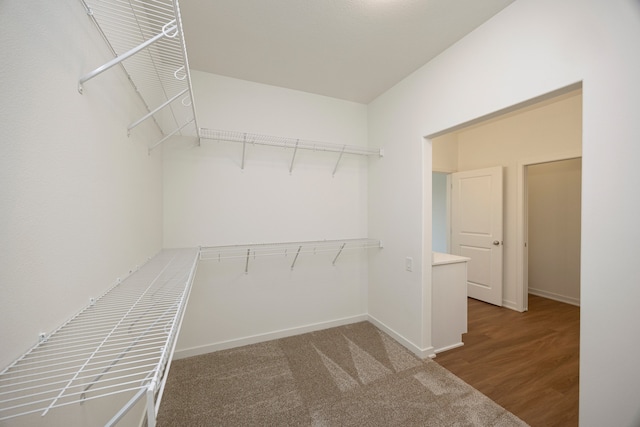 walk in closet featuring hardwood / wood-style flooring