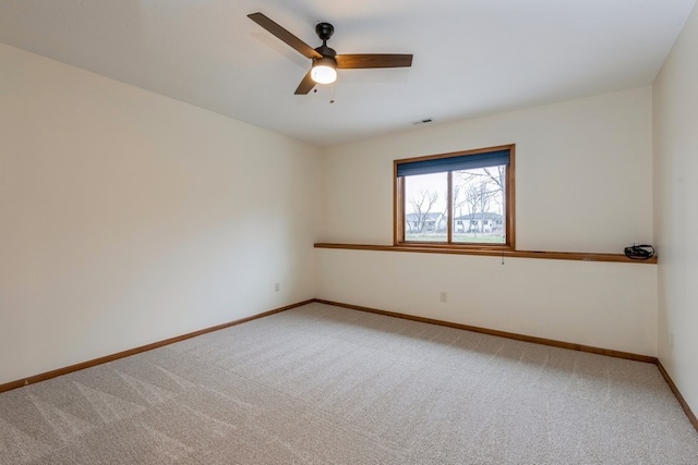 unfurnished room with carpet flooring and ceiling fan