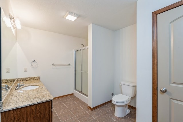 bathroom featuring vanity, tile patterned flooring, toilet, a textured ceiling, and an enclosed shower