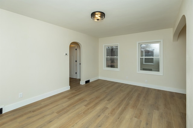 unfurnished room with light hardwood / wood-style flooring