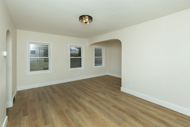 empty room featuring hardwood / wood-style flooring