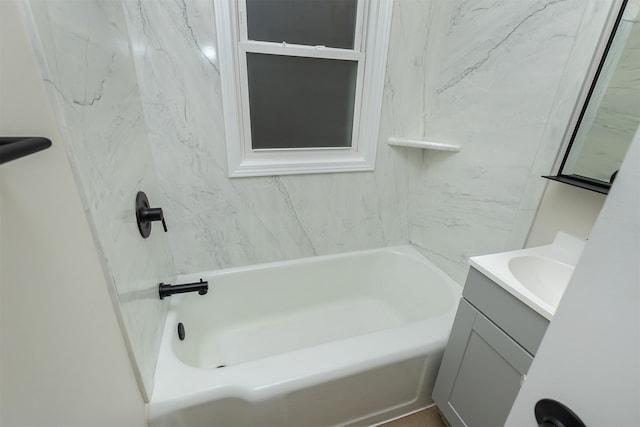 bathroom featuring vanity and tiled shower / bath combo