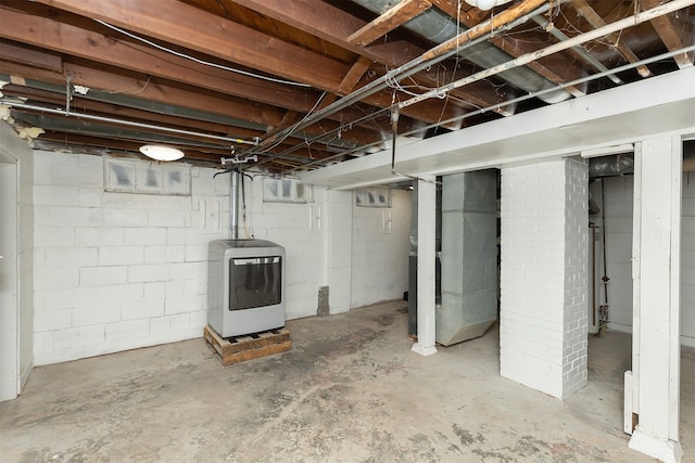 basement featuring washer / clothes dryer and heating unit