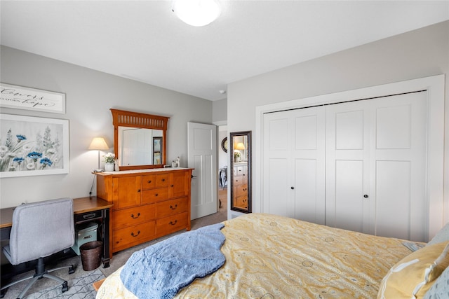 carpeted bedroom with a closet