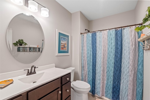 bathroom with toilet, vanity, and a shower with curtain