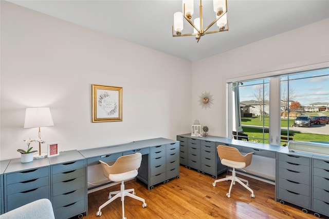 office space featuring light hardwood / wood-style flooring and a notable chandelier