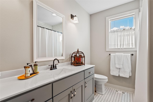 9441 Coneflower Cir, Norwalk, IA 50211 - bathroom with vanity, toilet, baseboards, and a shower with curtain