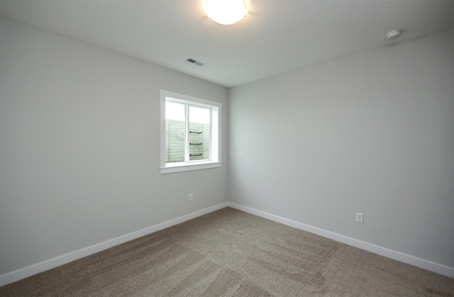 spare room with carpet flooring