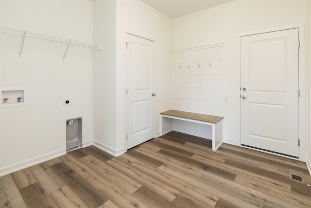 washroom featuring hookup for an electric dryer, wood-type flooring, and washer hookup