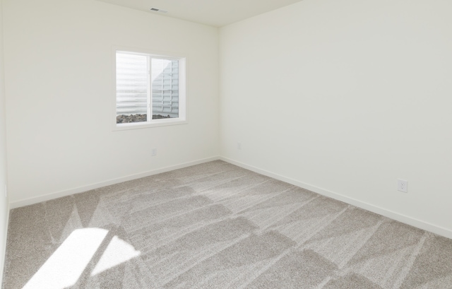 empty room with carpet flooring