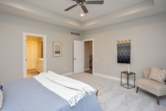 carpeted bedroom featuring connected bathroom and ceiling fan