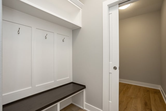 mudroom with hardwood / wood-style floors