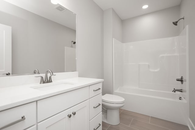 full bathroom with vanity, bathtub / shower combination, and toilet