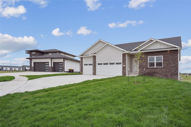 view of front of property with a garage and a front lawn