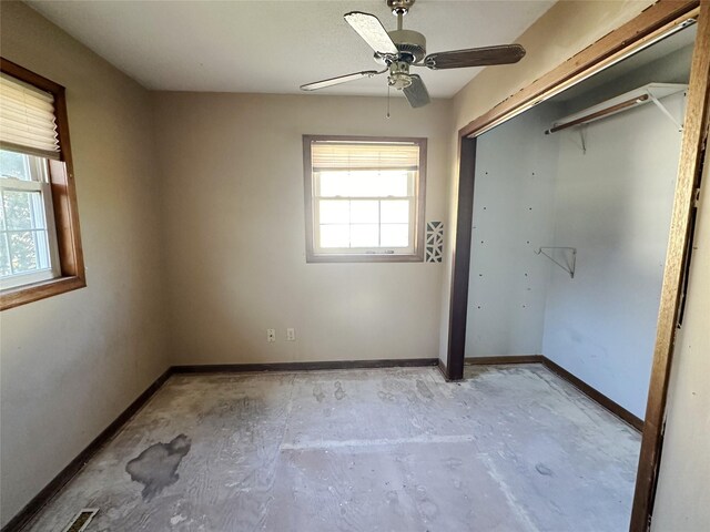 unfurnished bedroom with a closet, a ceiling fan, and baseboards