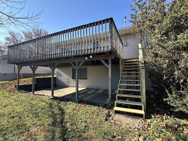 back of property with a patio area, a deck, and stairs