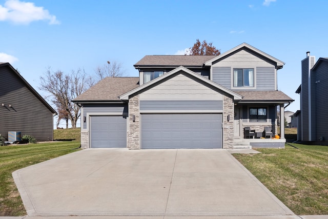 view of front of property with a garage and a front yard