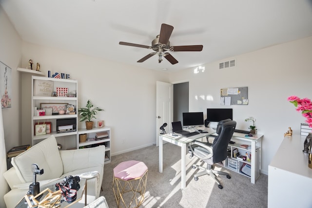 office space featuring carpet and ceiling fan