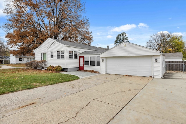 ranch-style house with a front lawn and a garage