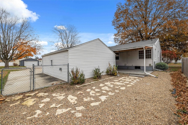 view of side of property with a patio