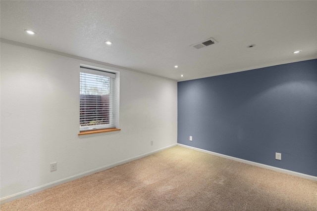 carpeted empty room with ornamental molding