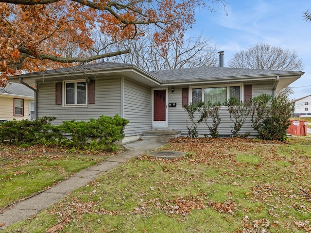 single story home with a front yard