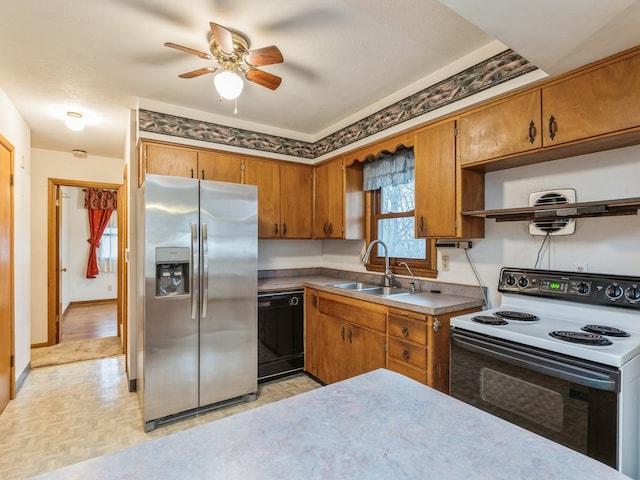 kitchen featuring ceiling fan, dishwasher, sink, white electric range oven, and stainless steel fridge