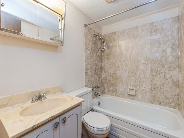 full bathroom featuring vanity, a textured ceiling, toilet, and tiled shower / bath combo