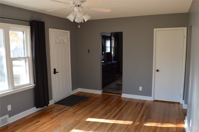 unfurnished bedroom featuring ceiling fan and hardwood / wood-style floors