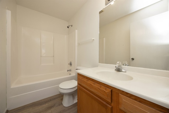 full bathroom featuring toilet, vanity, shower / bath combination, and hardwood / wood-style flooring