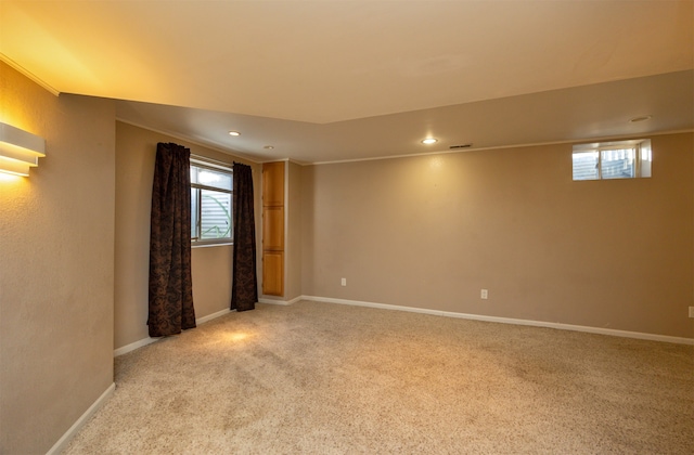 carpeted spare room with crown molding