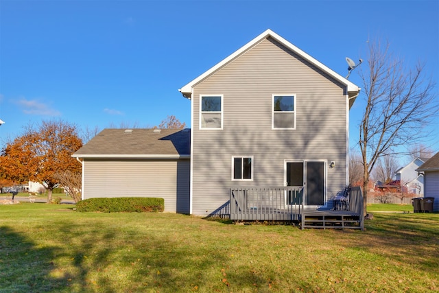 back of house with a lawn and a wooden deck