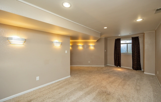 carpeted spare room with crown molding