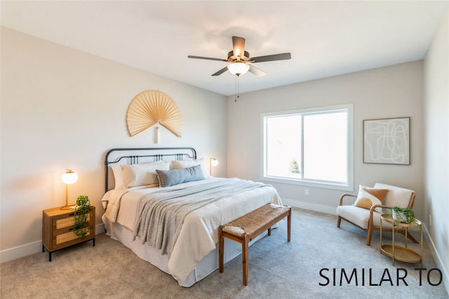 bedroom with ceiling fan and light colored carpet