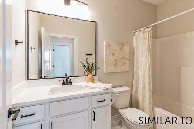 full bathroom featuring shower / tub combo, vanity, and toilet