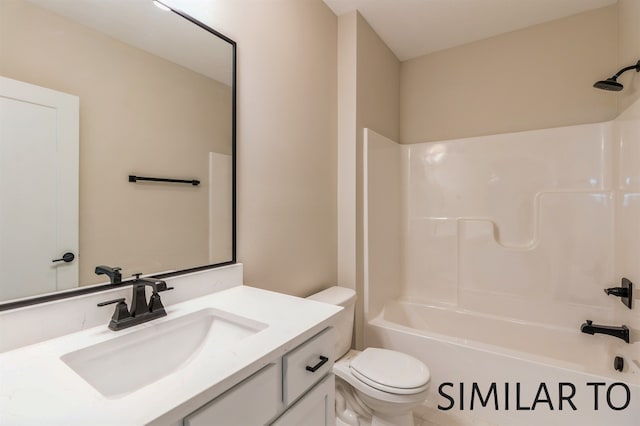 full bathroom featuring vanity, shower / bathing tub combination, and toilet